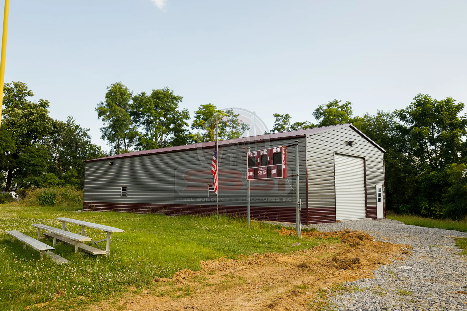 Custom metal field house with garage door