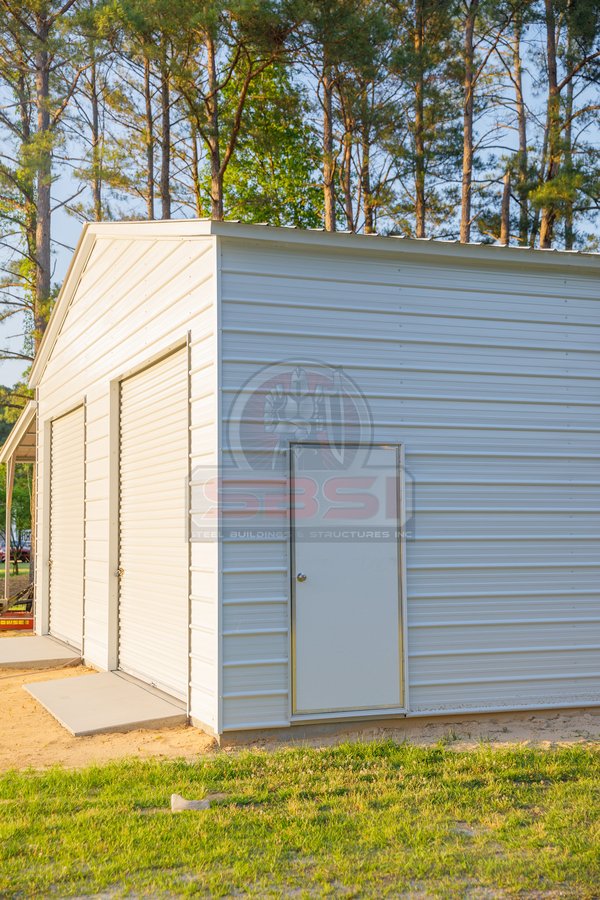 White workshop with 2 garage doors