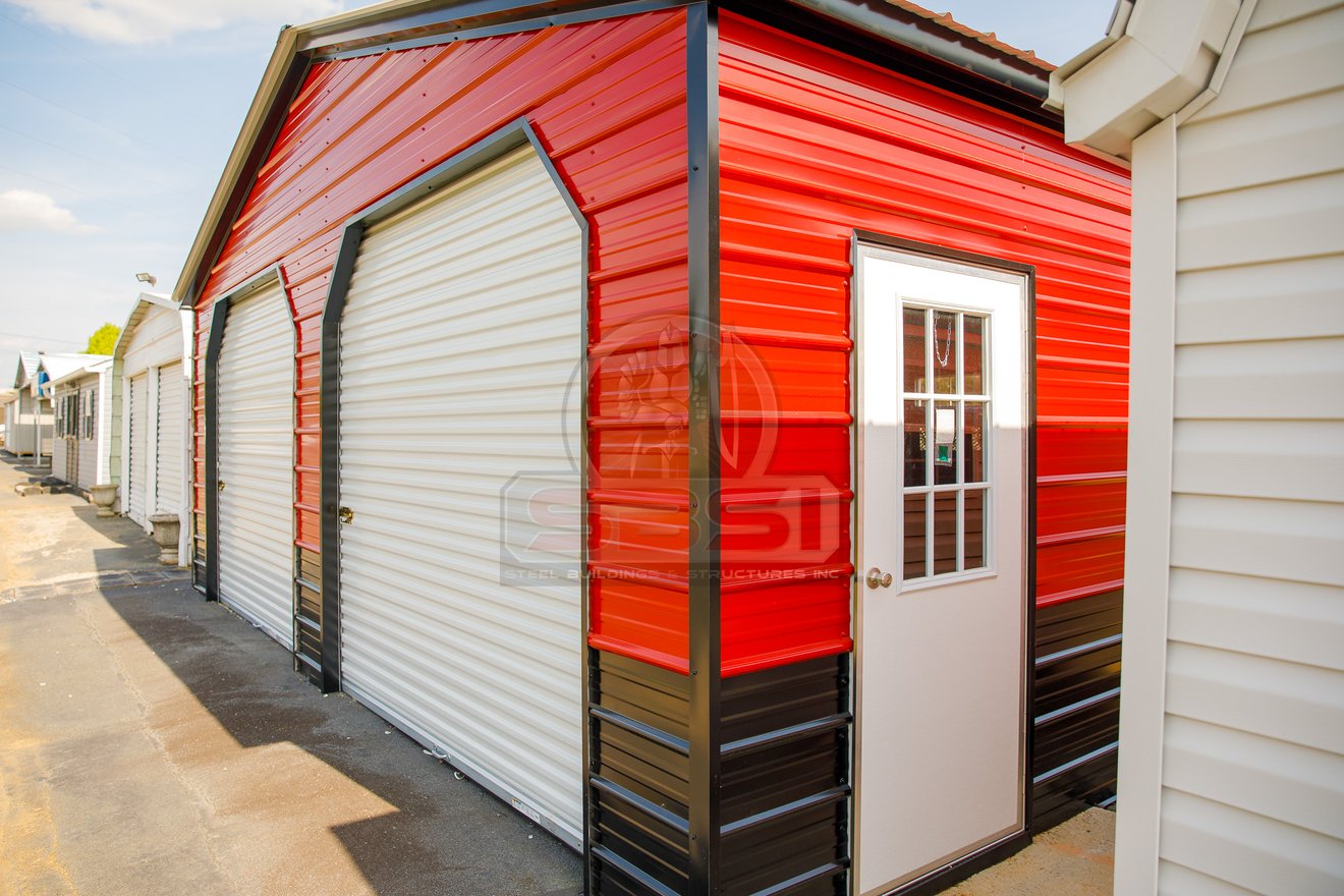 Custom metal building with 2 garage doors and side door