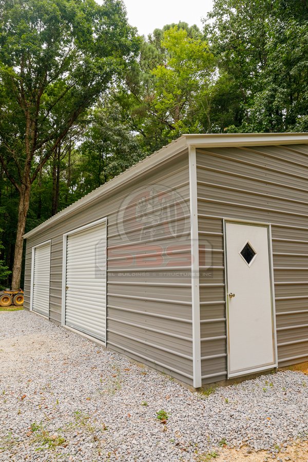 Pewter gray building with double garage doors