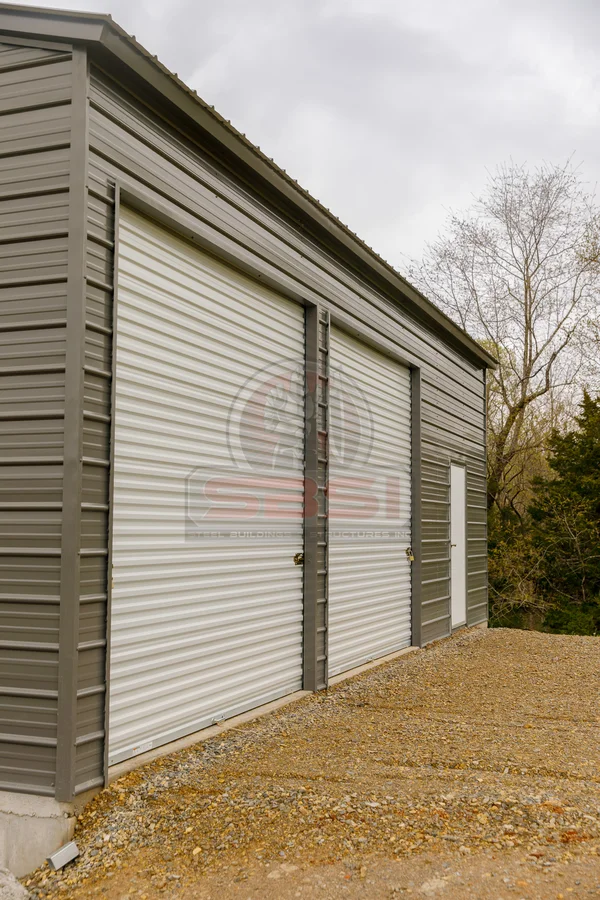 Side view of custom workshop with two garage doors