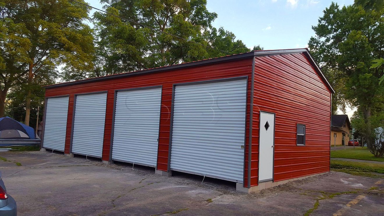 Fully enclosed side entry garage in barn red