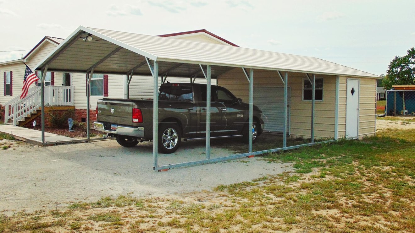 Single carport in sandstone with enclosed storage