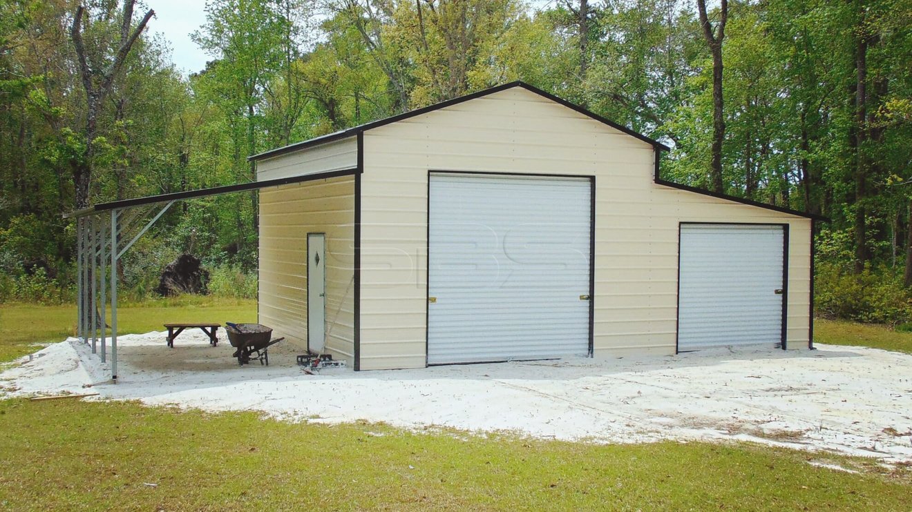 Fully enclosed metal barn with carport