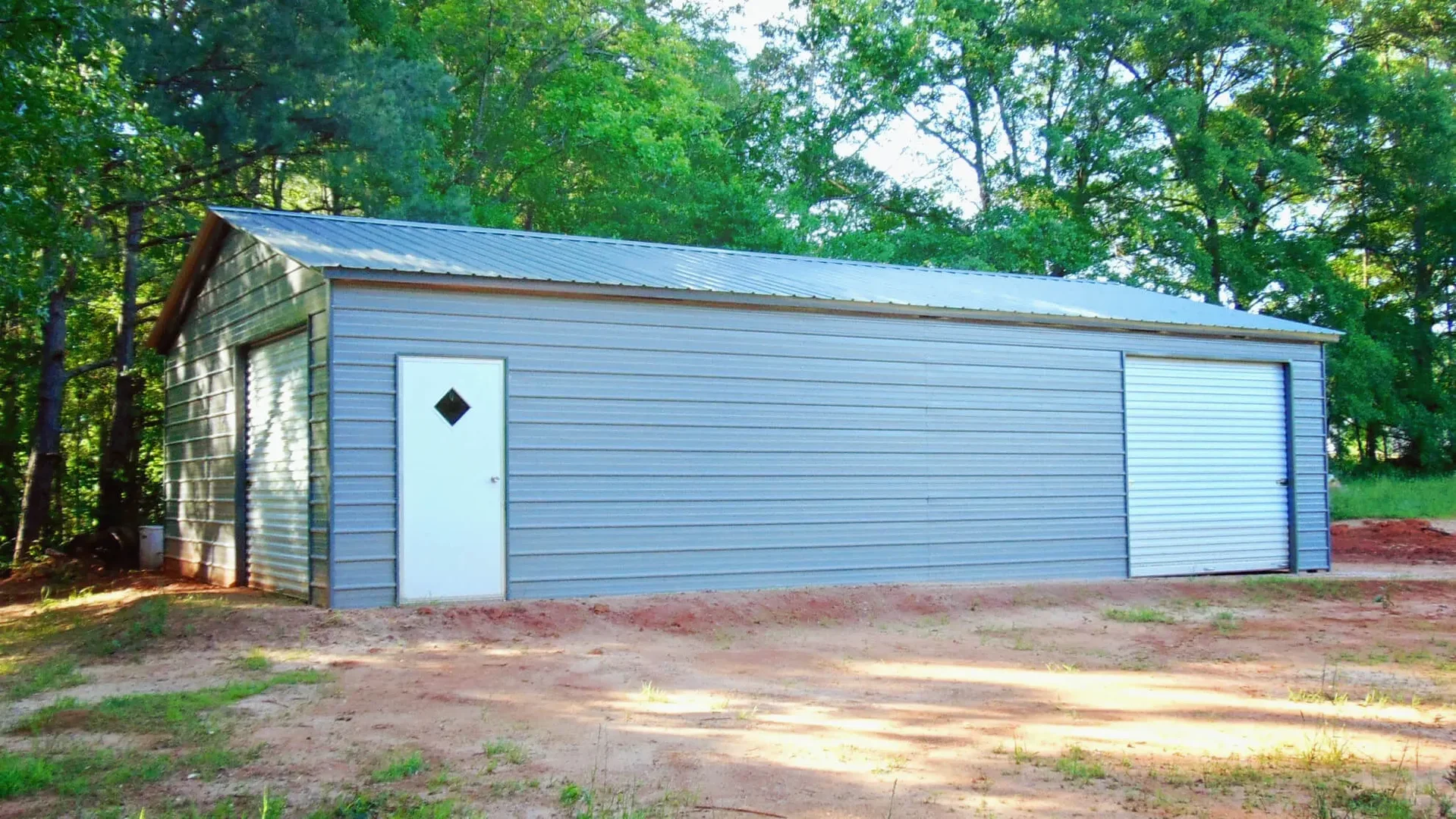 24 x 41 x 9 custom metal building with 2 garage doors